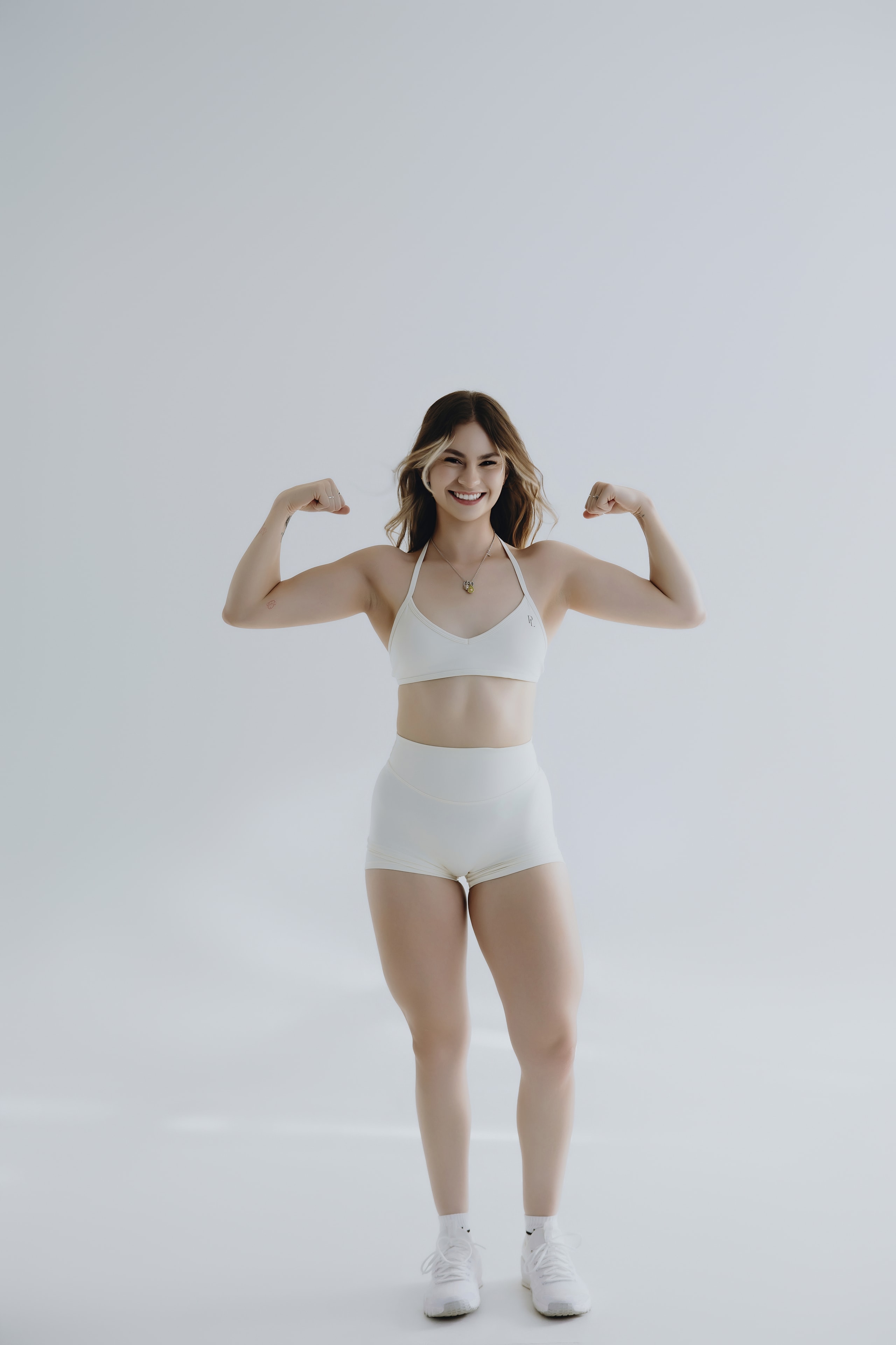Woman in blush pink soft activewear set